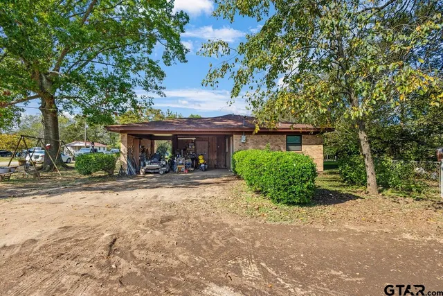 a view of a house with garden and plants