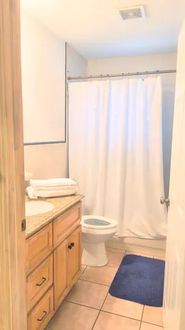 a hallway with a view of living room