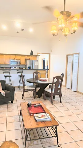 a spacious bathroom with a granite countertop sink and a large window