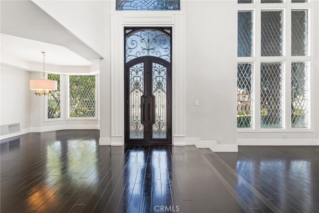 1608 Smiley Ridge Redlands, CA 92373 - Photo 8 of 84 an empty room with wooden floor and a window