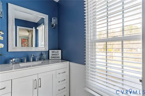 a view of a bedroom with a bed and a window