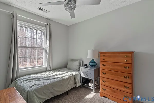 a view of a house with a yard and garage