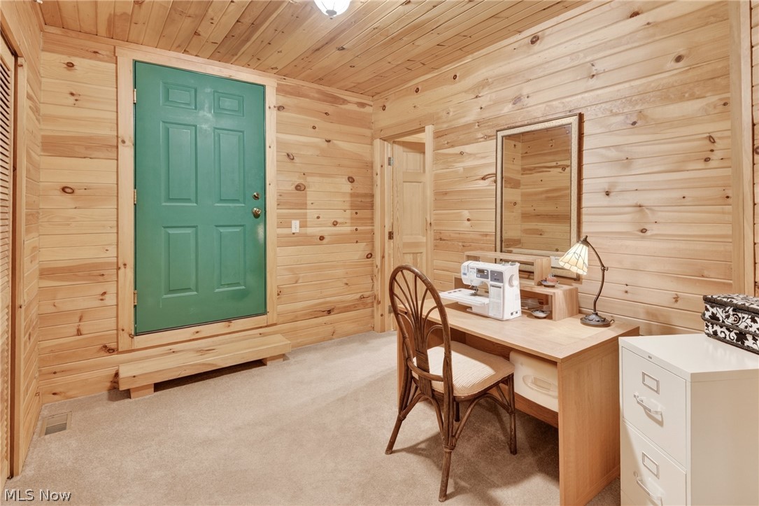 16727 Pitts Road Wellington, OH 44090 - Photo 26 of 50 Upstairs hobby nook with door leading into the unfinished attic storage area