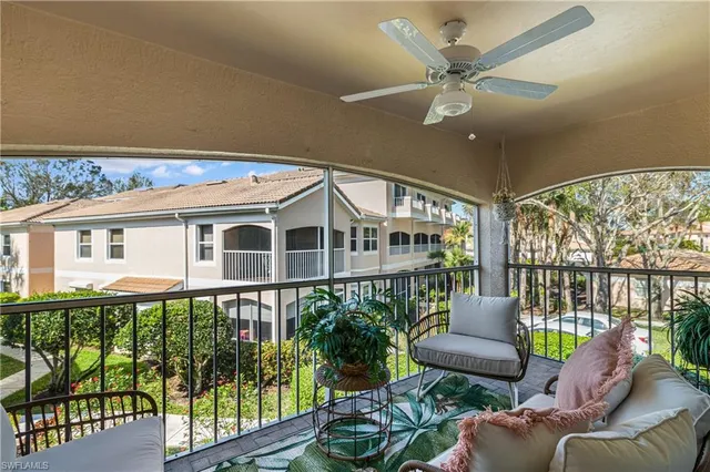 a balcony with furniture and garden view