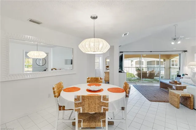 a dining table seating space a sink and a window
