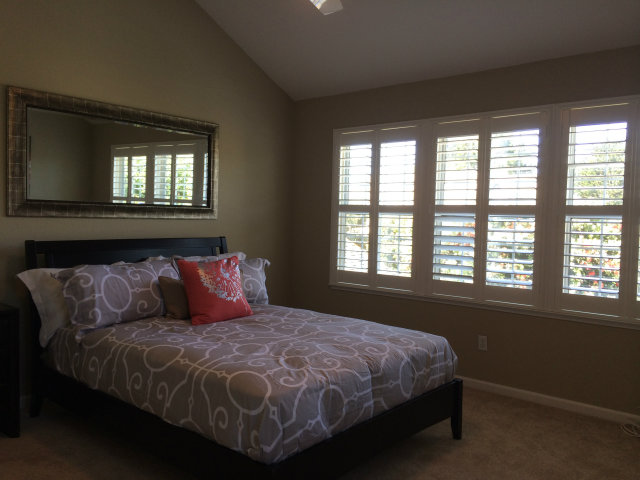 9 Muirfield Road Half Moon Bay, CA 94019 - Photo 12 of 16 a bed sitting in a bedroom next to a window