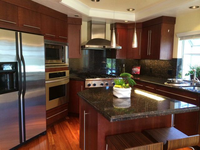 9 Muirfield Road Half Moon Bay, CA 94019 - Photo 2 of 16 a kitchen with a stove and a microwave