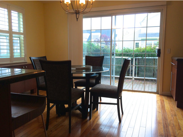 9 Muirfield Road Half Moon Bay, CA 94019 - Photo 6 of 16 a view of a dining room with furniture and wooden floor