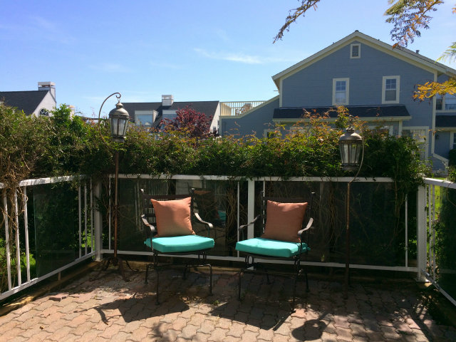 9 Muirfield Road Half Moon Bay, CA 94019 - Photo 7 of 16 a wooden bench sitting in front of a house