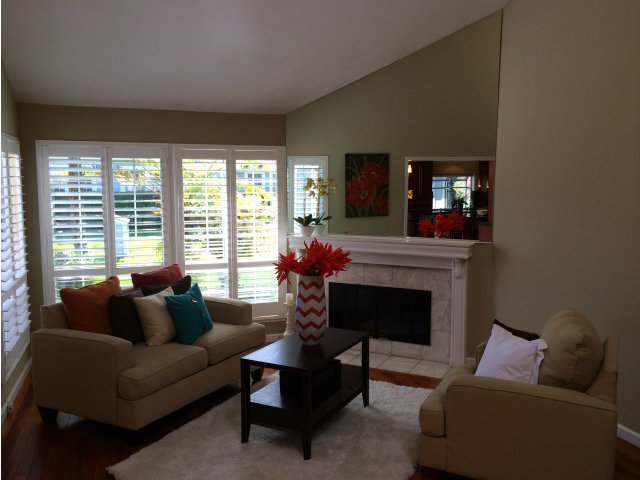 9 Muirfield Road Half Moon Bay, CA 94019 - Photo 8 of 16 a living room with furniture a large window and a fireplace