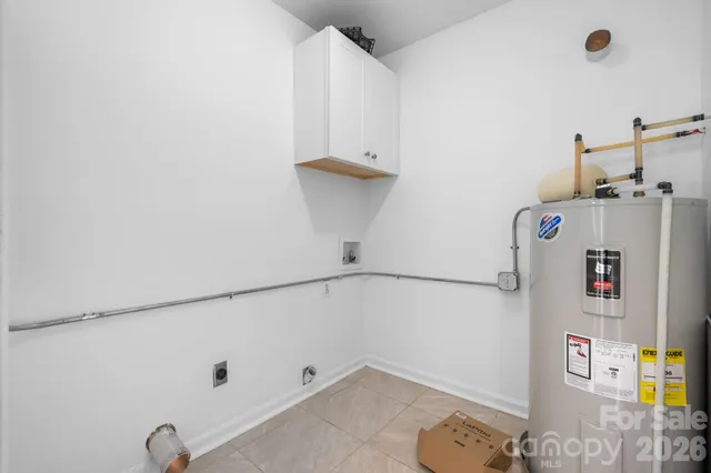a view of storage and utility room with washer and dryer