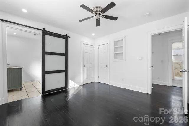 a view of a livingroom with wooden floor