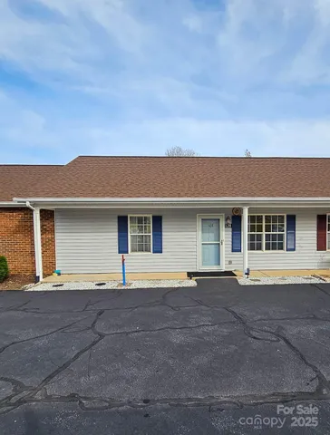 a front view of a house with garage