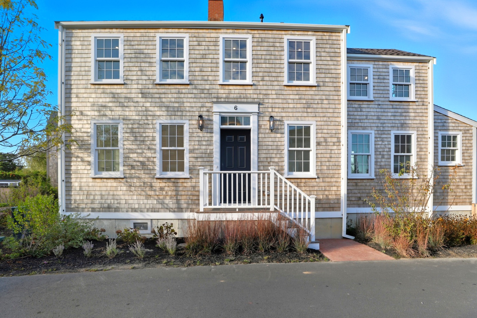 6 Mariner Way Nantucket, MA 02554 - Photo 2 of 31 a front view of a house with a garden