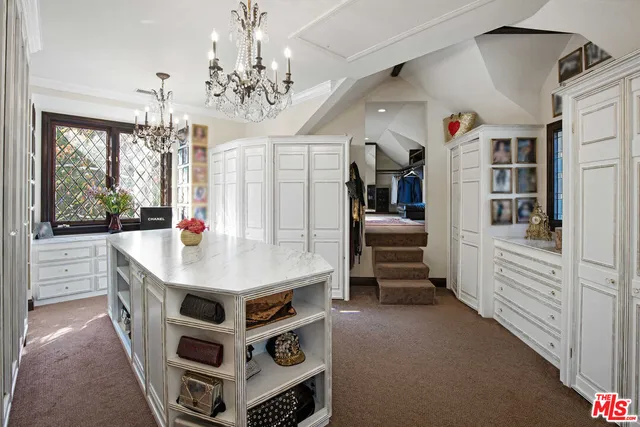 a kitchen with a stove a refrigerator a sink and dishwasher with a large kitchen island