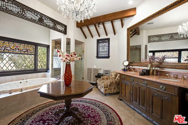 a bedroom with furniture and a window