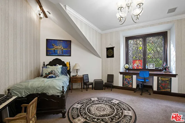 a living room with furniture a rug and a table