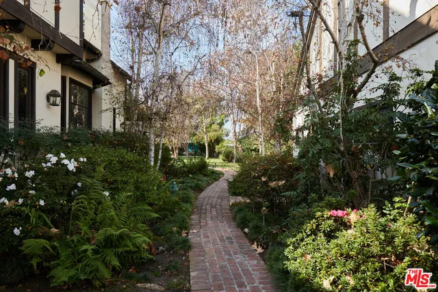 a view of a swimming pool with a yard