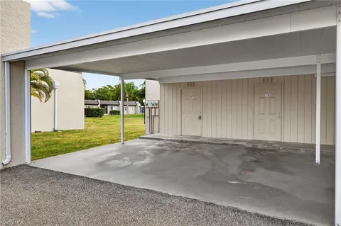a view of a kitchen with a sink and a refrigerator