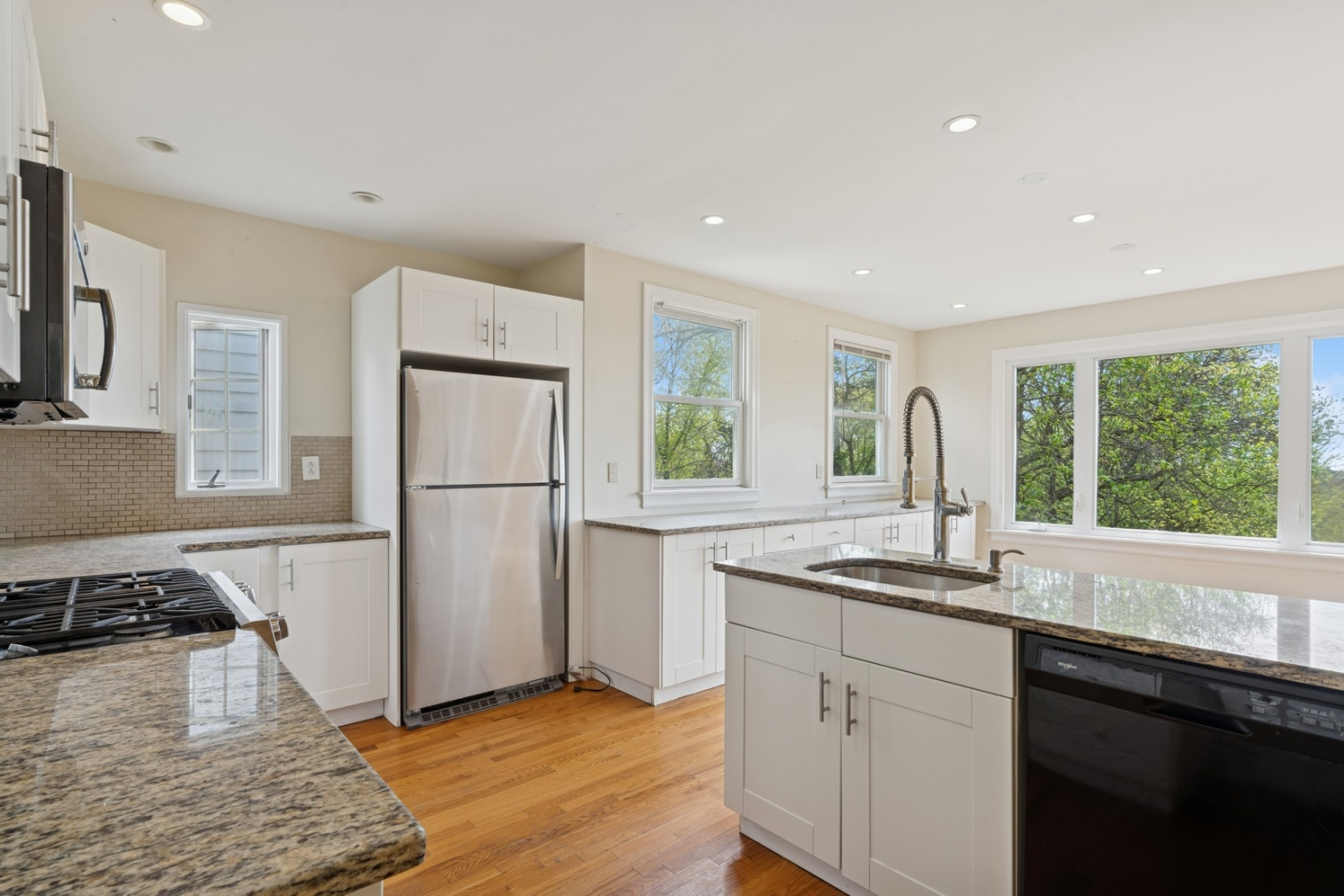 1197 Todt Hill Road Staten Island, NY 10304 - Photo 12 of 17 a kitchen with a refrigerator a sink and a window