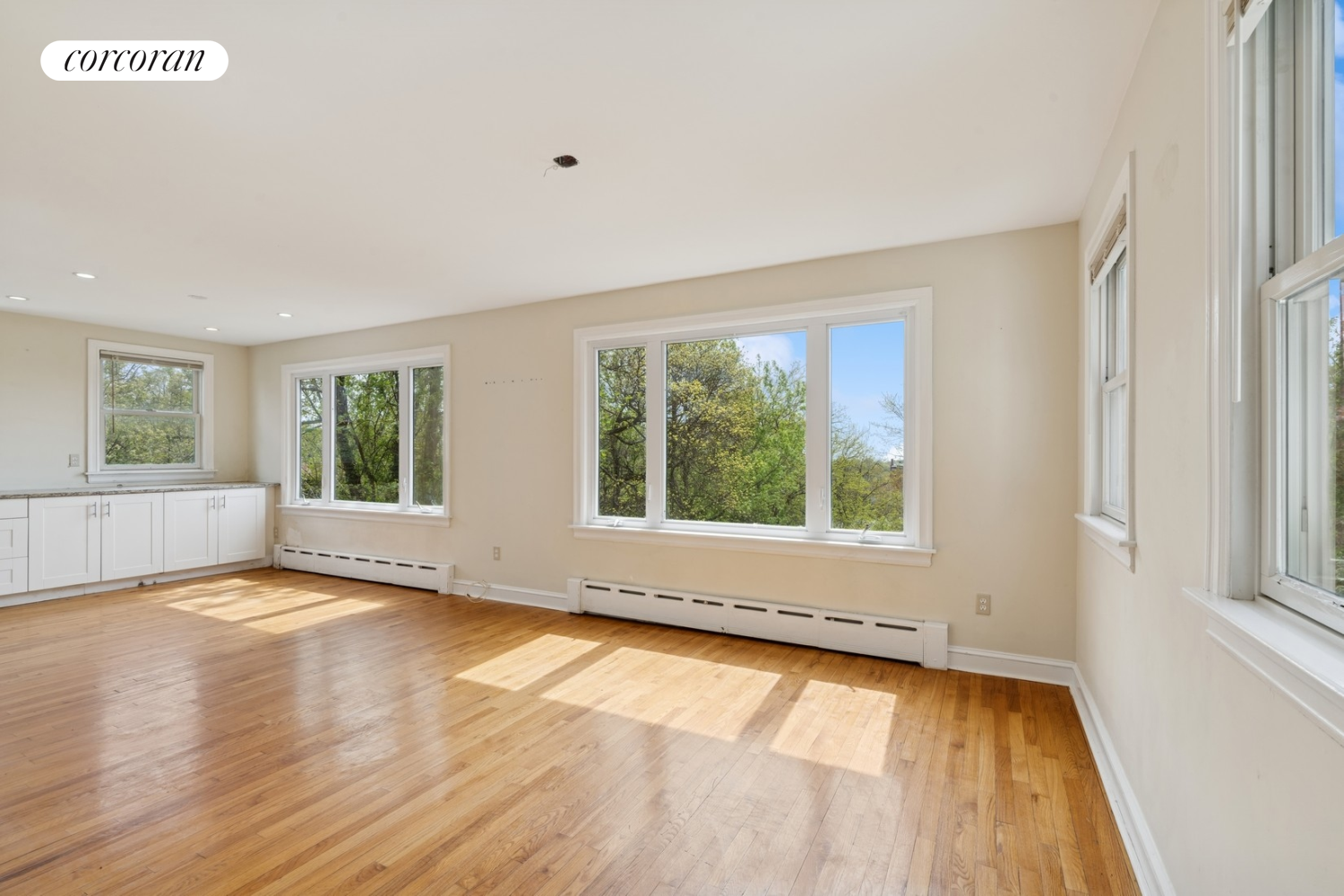 1197 Todt Hill Road Staten Island, NY 10304 - Photo 4 of 17 a view of an empty room with wooden floor and a window