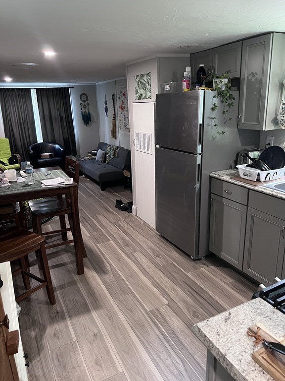 a kitchen with stainless steel appliances granite countertop a refrigerator sink and cabinets