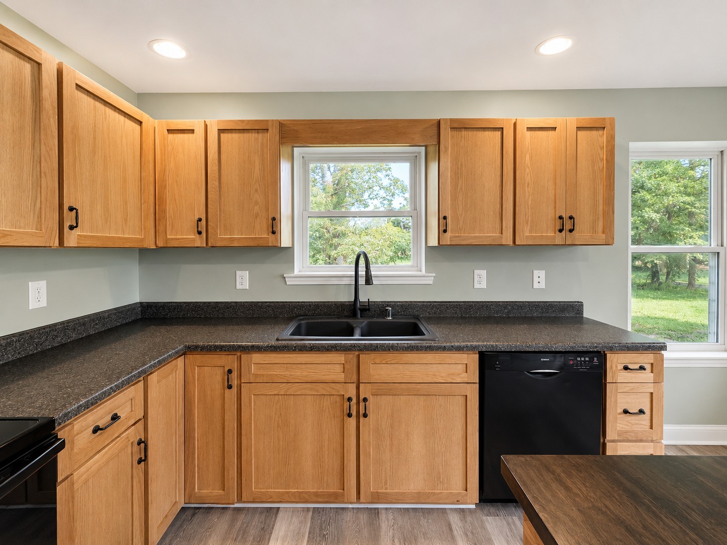 352 Main Street Cerulean, KY 42215 - Photo 9 of 32 a kitchen with granite countertop a sink and white cabinets