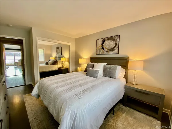 a bedroom with bed and window