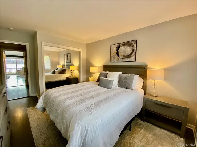 a bedroom with bed and window