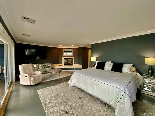 a bedroom with a bed and couch