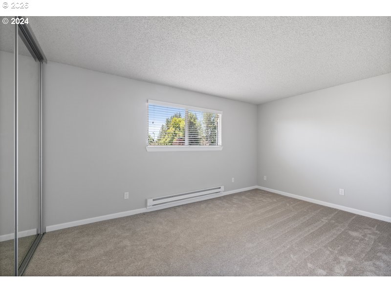 2921 Northeast Rene Avenue, Unit 15B Gresham, OR 97030 - Photo 11 of 22 an empty room with windows