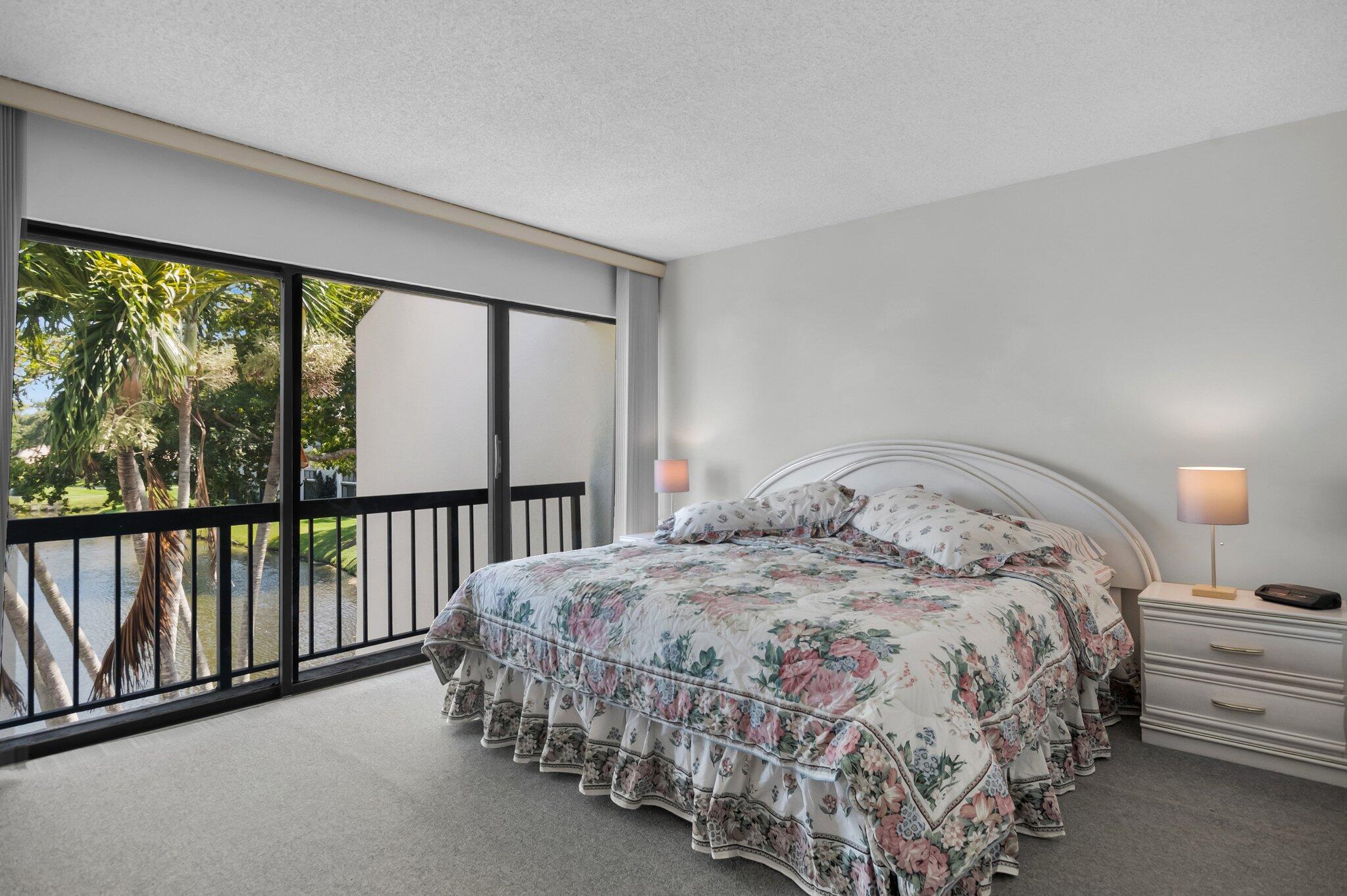 805 Bridgewood Place Boca Raton, FL 33434 - Photo 17 of 60 a bedroom with a bed and a large window