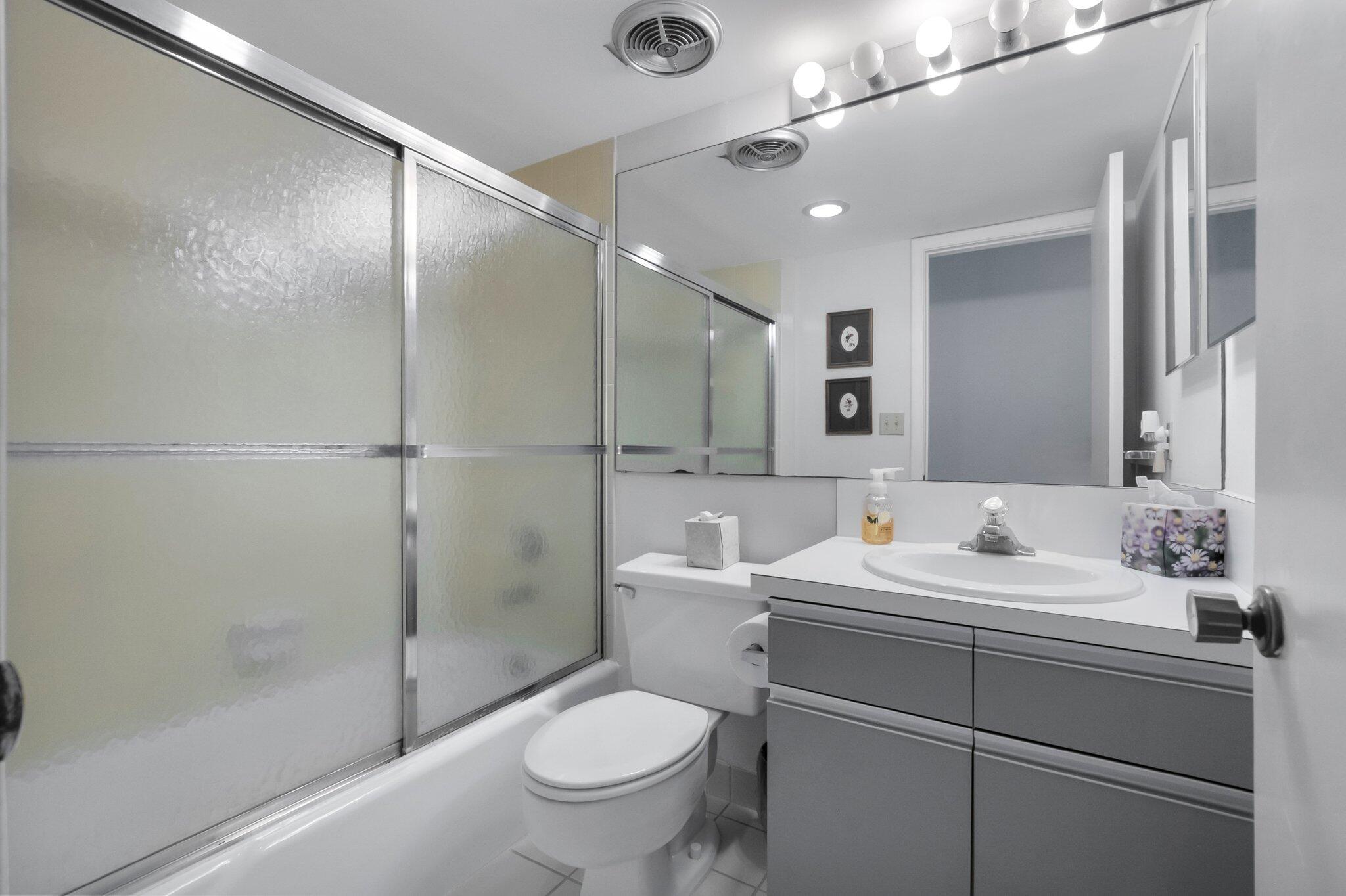 805 Bridgewood Place Boca Raton, FL 33434 - Photo 22 of 60 a bathroom with a sink toilet and shower