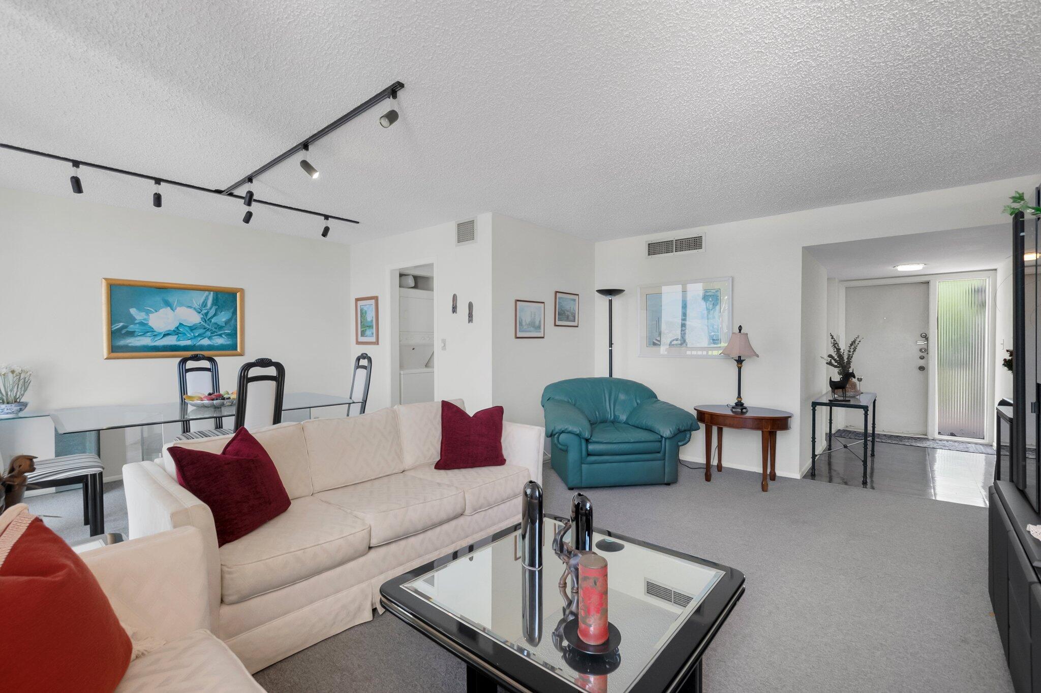 805 Bridgewood Place Boca Raton, FL 33434 - Photo 6 of 60 a living room with furniture or couch and a potted plant