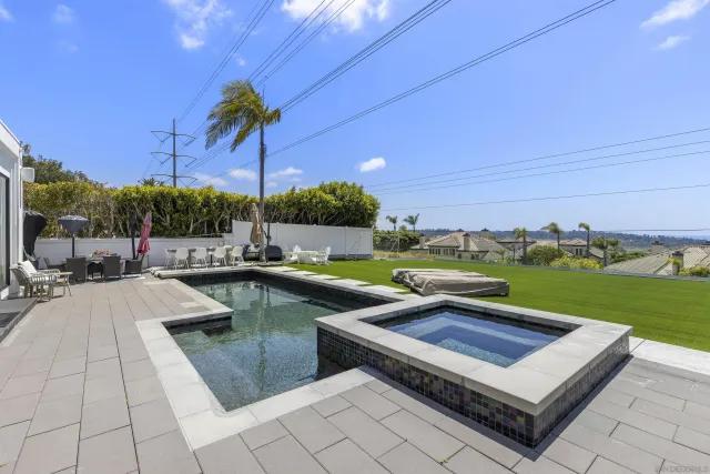 a view of a patio with a yard