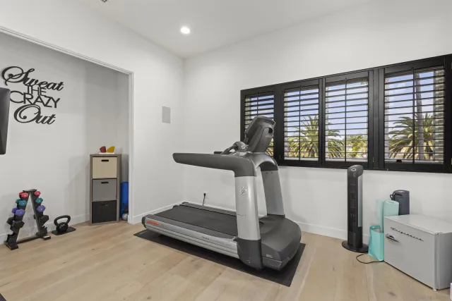 a large bedroom with a bed and furniture