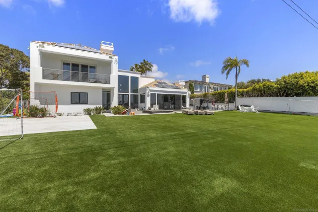 a view of a patio with chairs and a table