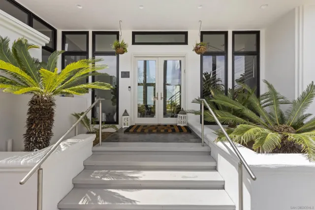 a view of staircase with white walls