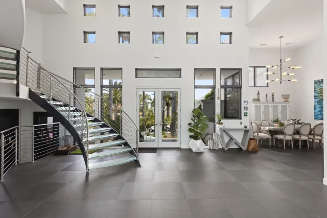 a lobby with furniture and stairs