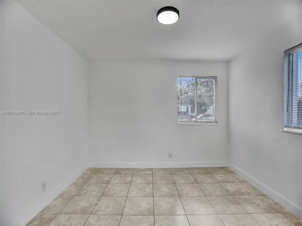 a view of an empty room and window