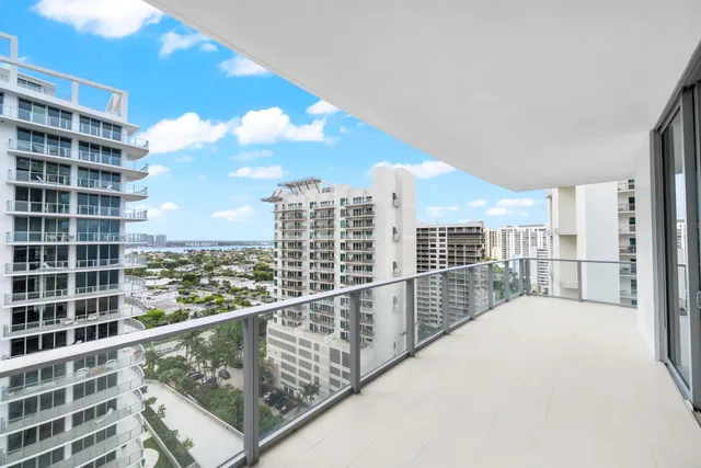 a view of an empty room with a large window and pool