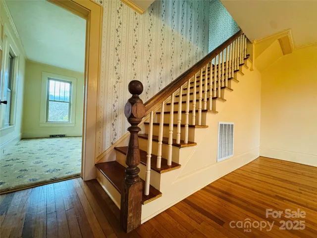 a view of entryway with wooden floor