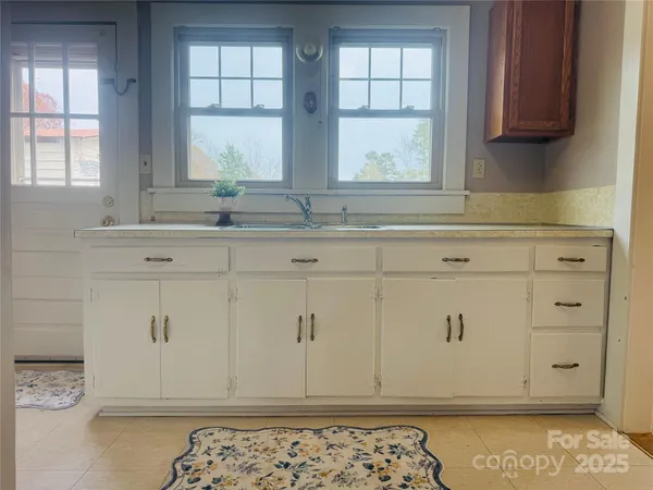 a view of cabinets and window