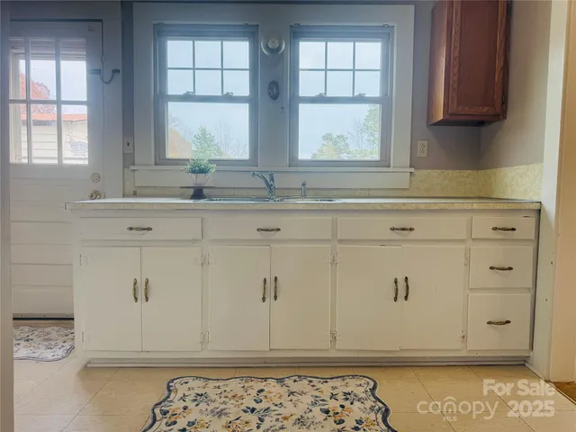 a view of cabinets and window