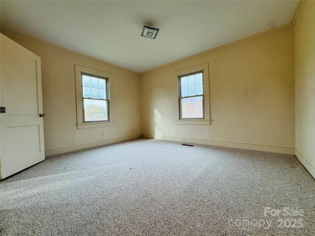 an empty room with windows
