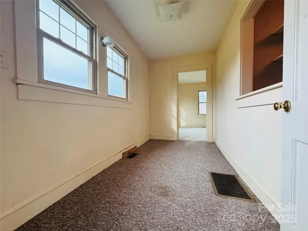 an empty room with windows