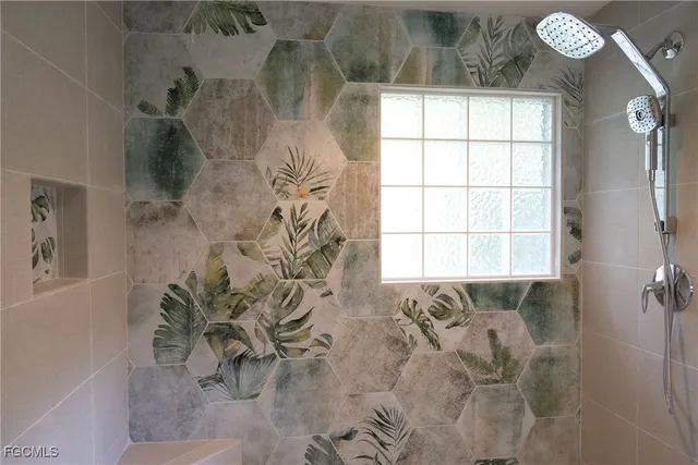 a bathroom with a bathtub sink and window