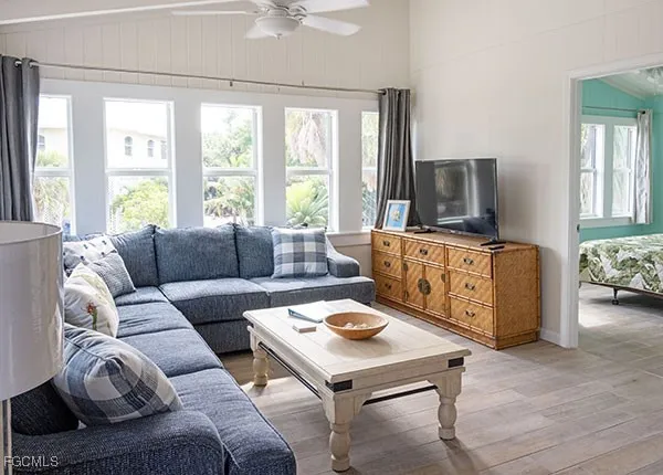 a living room with furniture and a flat screen tv