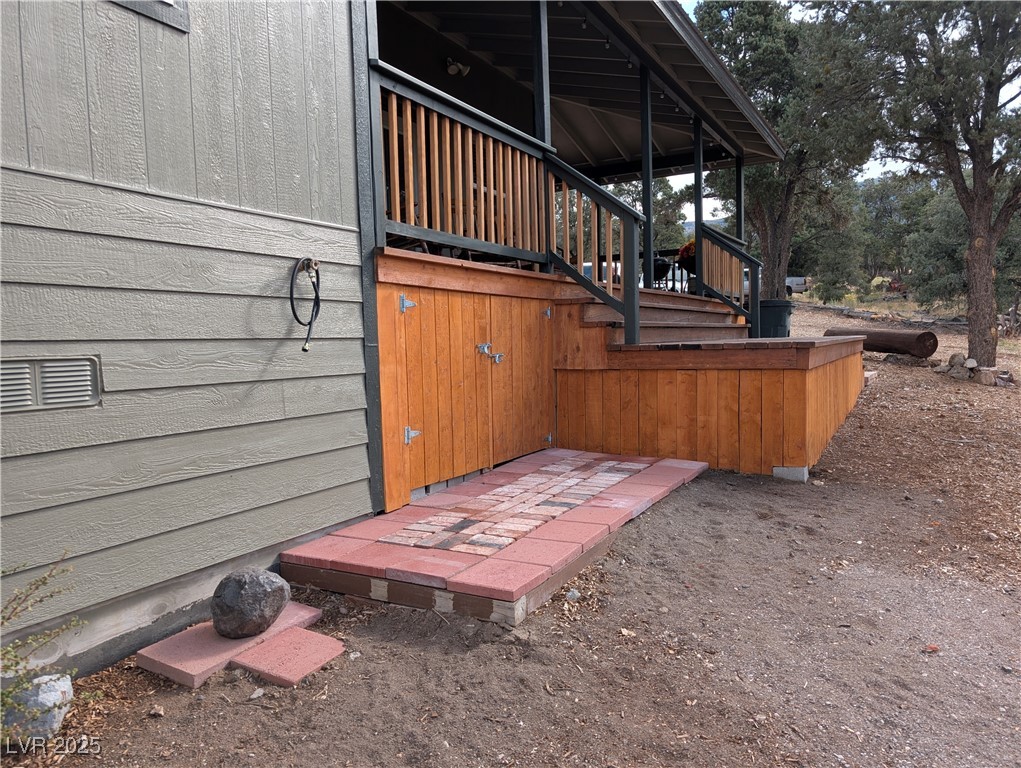 8320 Mother Lode Road Pioche, NV 89043 - Photo 18 of 46 View of home's exterior with stairway and a wooden deck