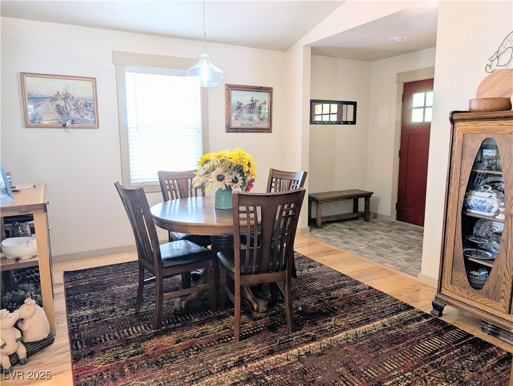8320 Mother Lode Road Pioche, NV 89043 - Photo 27 of 46 Formal Dining area featuring light wood-style flooring and baseboards